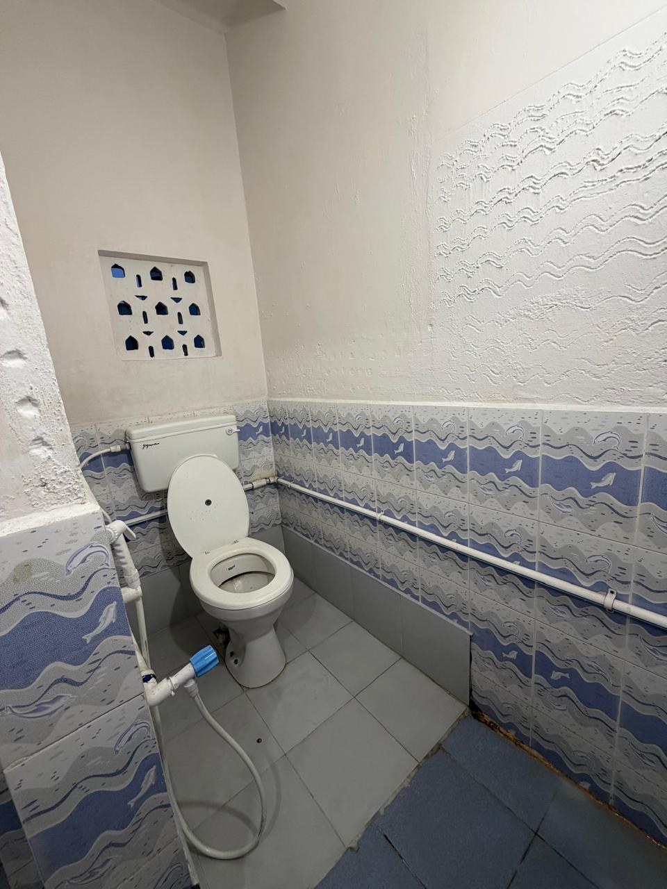 Hygienic Western toilet attached to the four sharing room